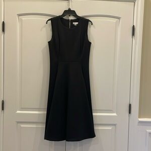 Calvin Klein black tie dress size 10 so cute with pockets.Sleeveless. Worn once